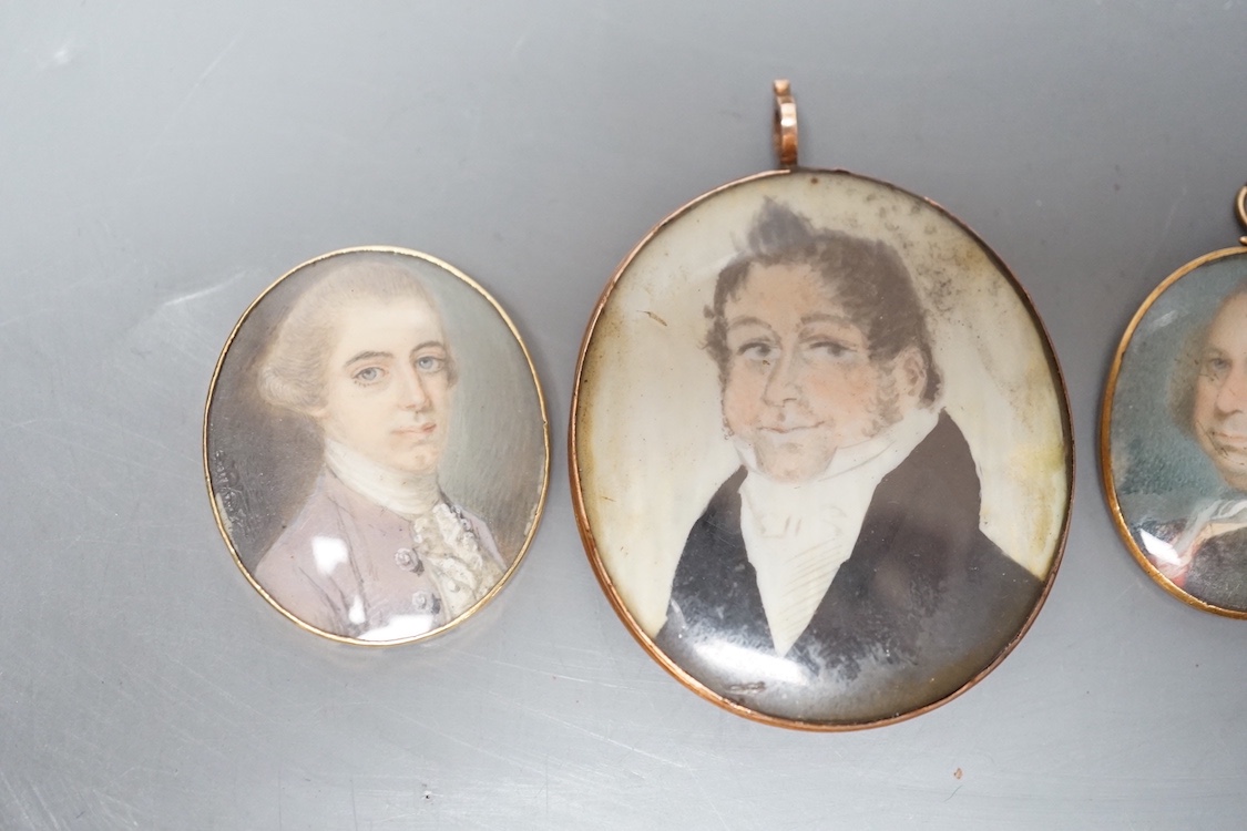 Three Georgian portrait miniatures on ivory of gentlemen, largest 5 cms high, two gold framed
